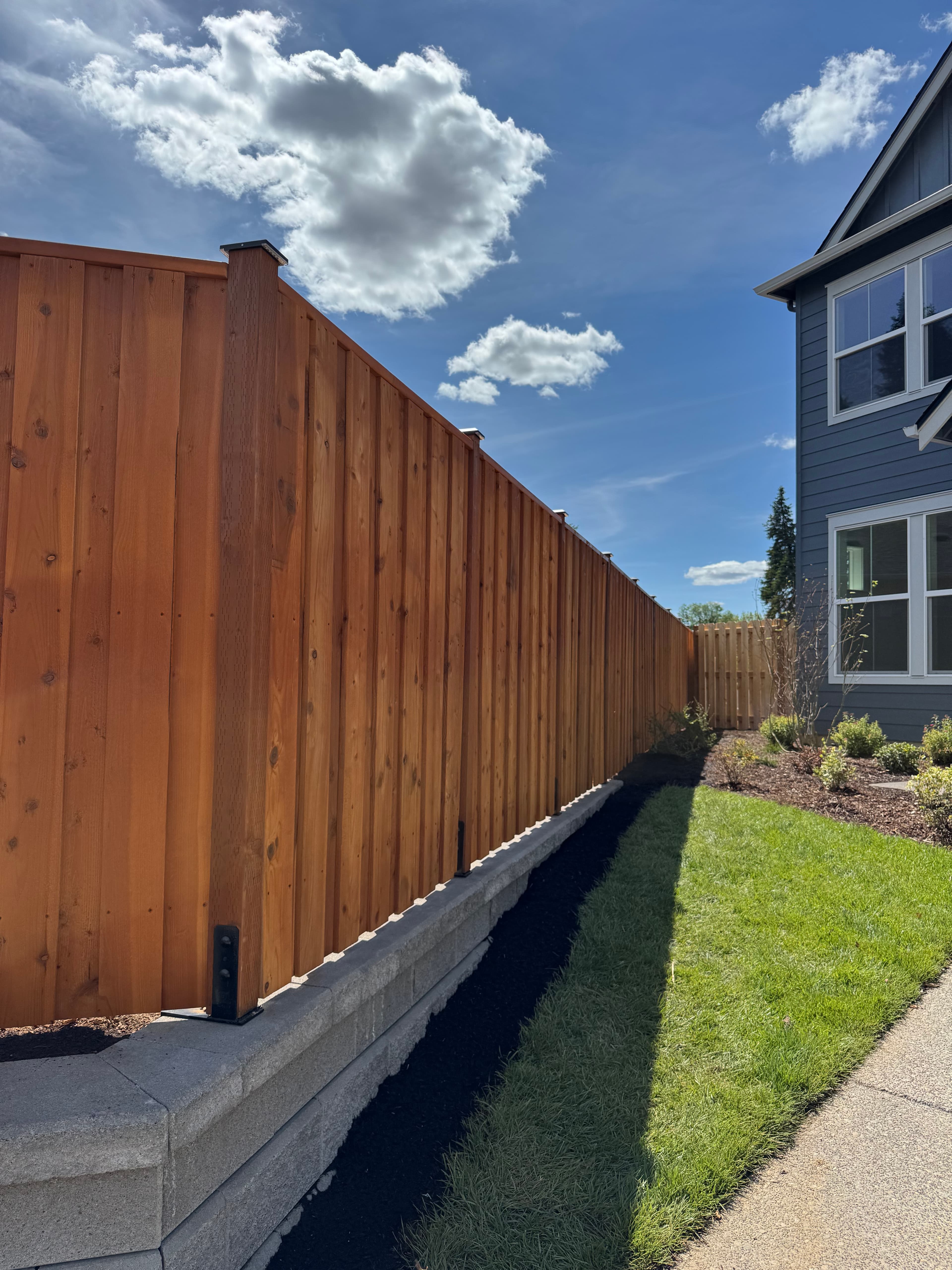 Cedar privacy fence installation with retaining wall Clark County WA