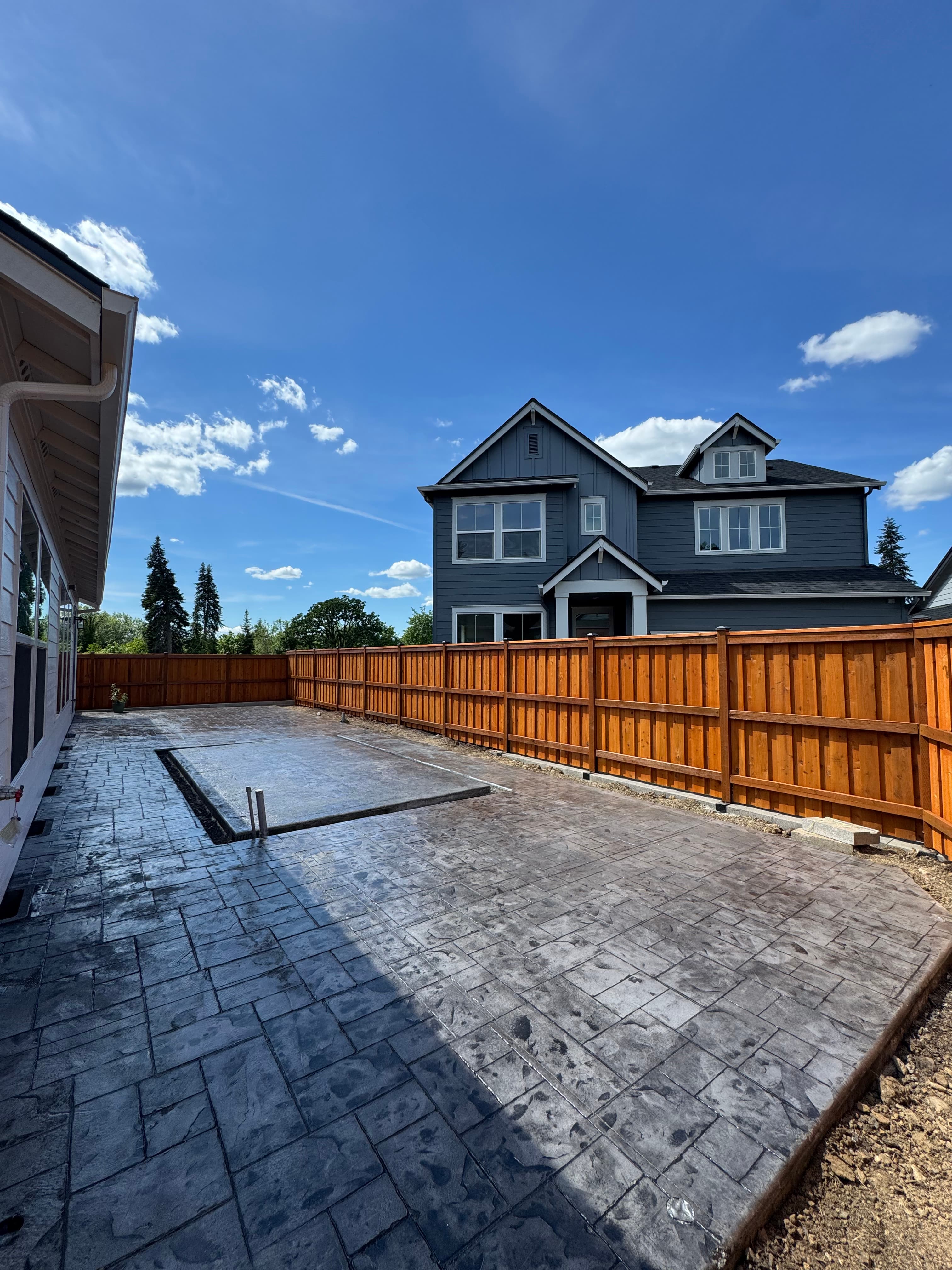 Cedar fence and stamped concrete patio installation Vancouver WA