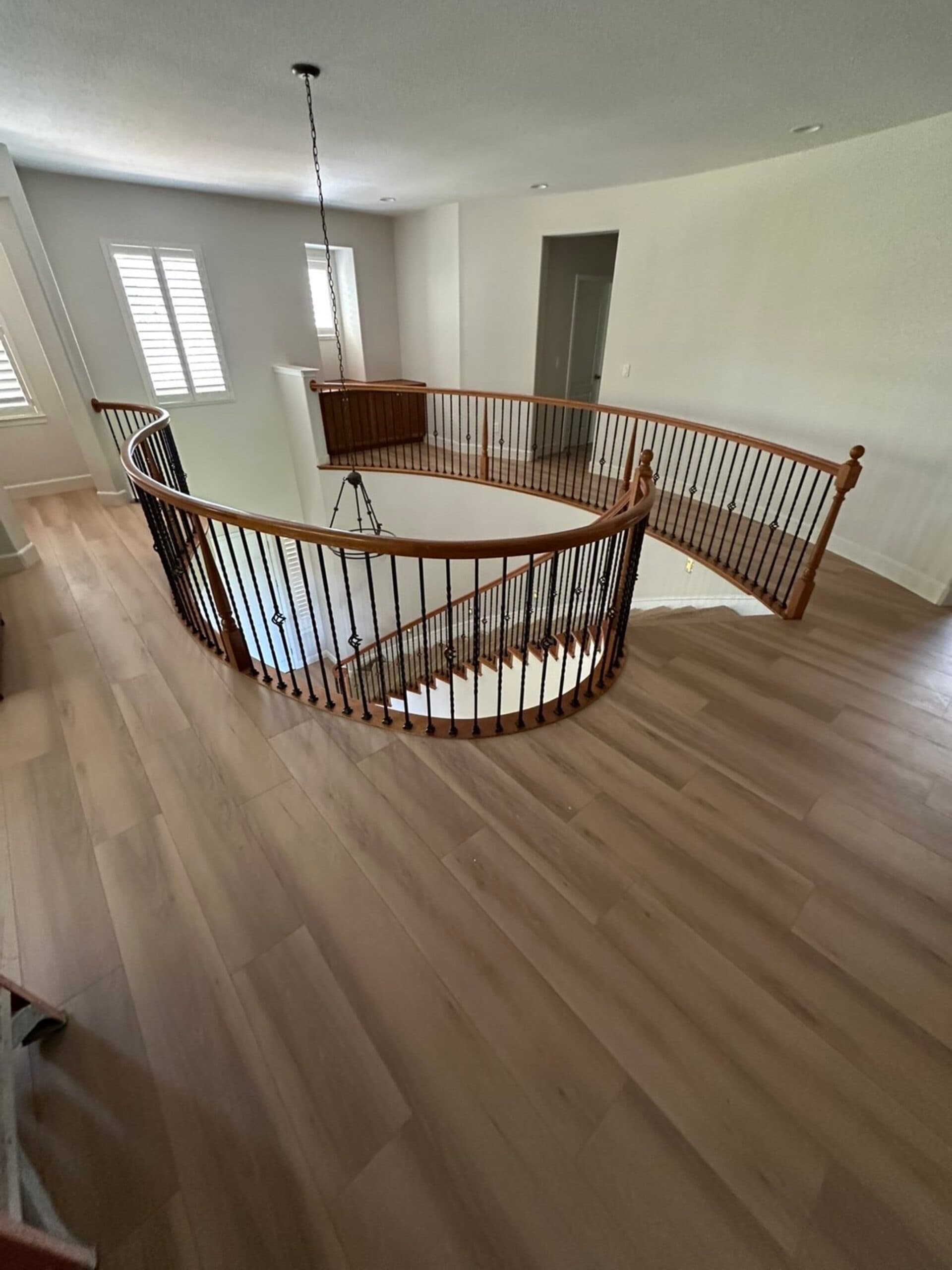 Wide plank hardwood flooring upper landing staircase Clark County WA